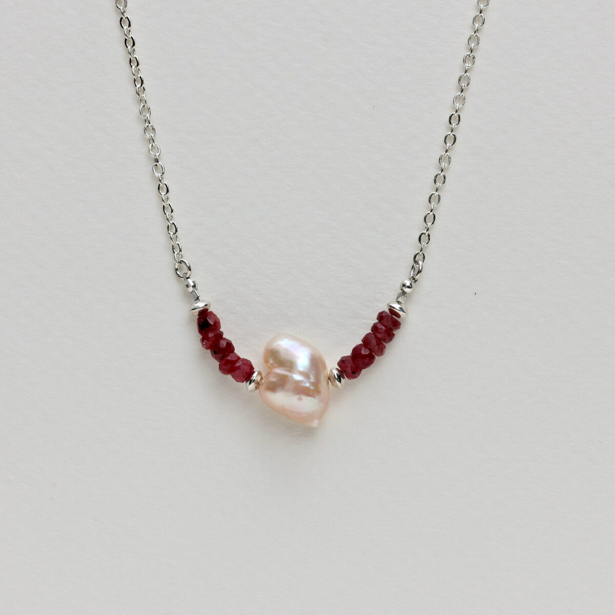 Unconditional Love: Heart-Shaped Pearl and Ruby Necklace